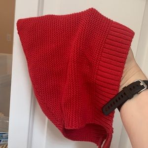 A red knit elf baby winter hat